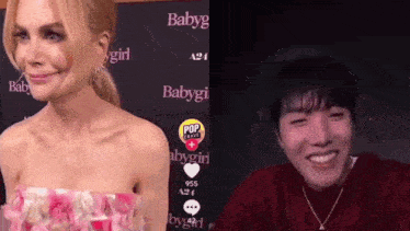 a woman in a pink dress is next to a man in a red sweater