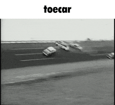 a black and white photo of cars on a road with the word toecar above them