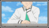 a blurry picture of a man in a white shirt and green tie sitting on a balcony .