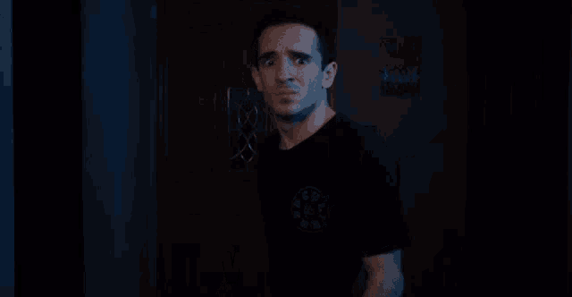 a man in a black shirt says what
