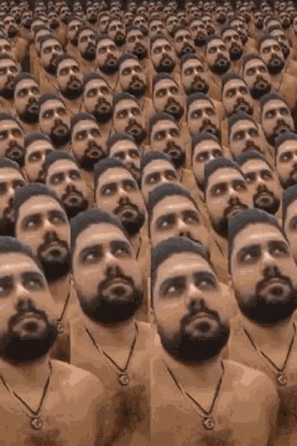a bunch of bearded men are standing in a row .