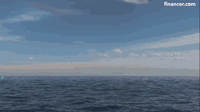 an explosion in the ocean with a circle with the letter e on it