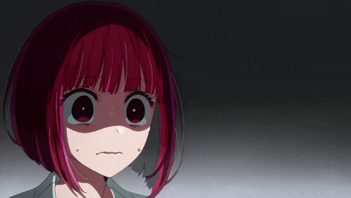 a close up of a girl with red hair making a funny face