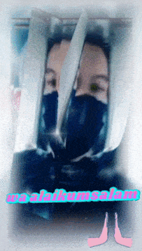 a picture of a person wearing a mask with the name alakumsalam written on the bottom