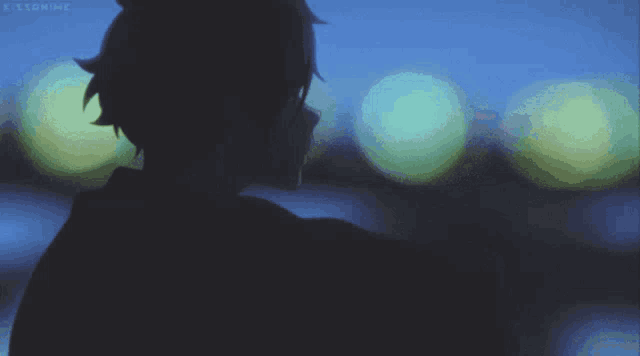 a silhouette of a person with the letters k on the bottom right corner