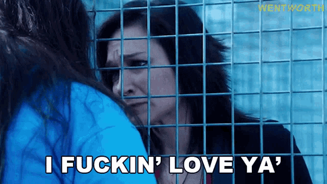 a woman behind bars with the words i fuckin ' love ya '