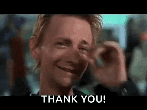 a man is crying while holding his nose and saying thank you .