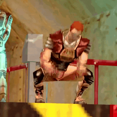 a man in a video game is squatting down in front of a yellow and red barrier