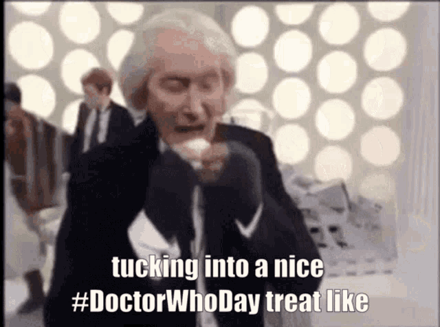 a man in a suit and tie says tucking into a nice #doctor who day treat like