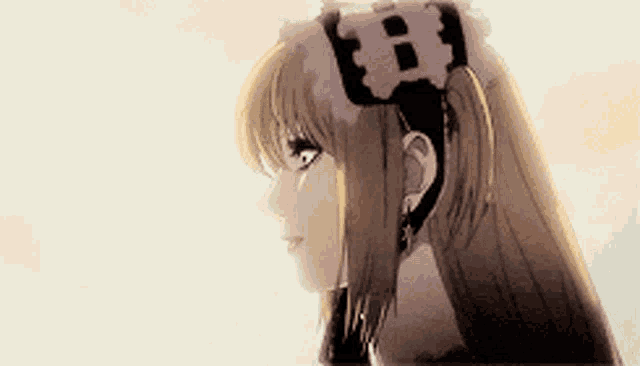 a close up of a girl 's head with a flower in her hair with the letter b on it