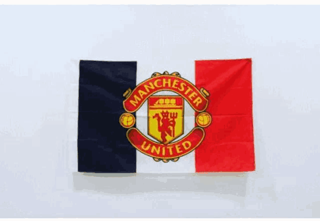 a manchester united flag with a red , white and blue flag on a white background .
