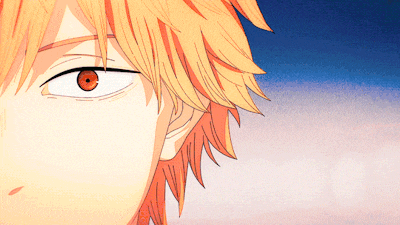 a close up of a person 's face with orange hair