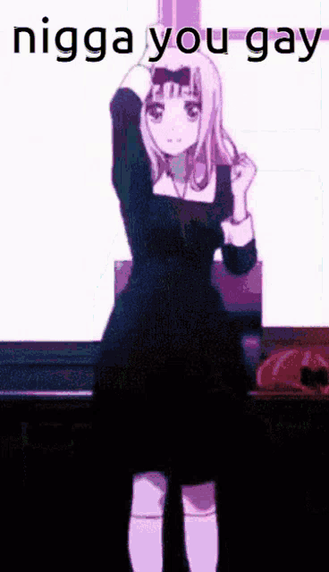 a girl in a black dress is standing in front of a sign that says " nigga you gay "