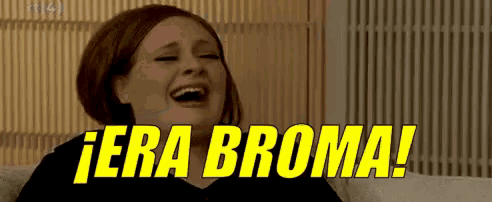 a woman is laughing while sitting on a couch with the words " era broma " written in yellow