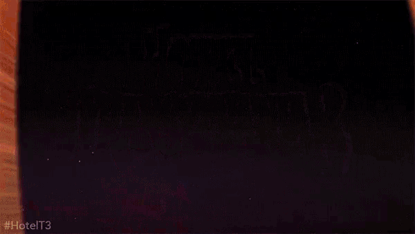 a black background with a yellow and orange stripe on the bottom
