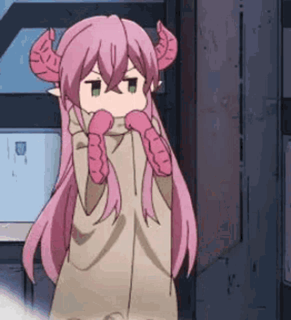 a pink haired anime girl with horns is standing in front of a building .