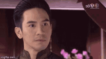 a close up of a man 's face looking at the camera .