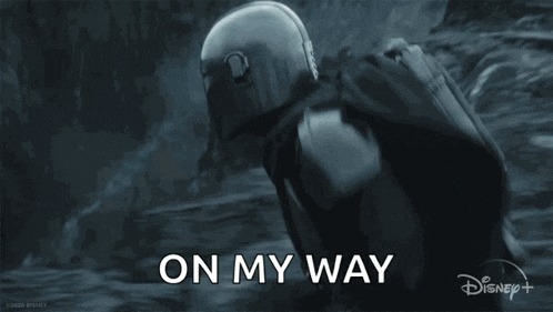 a man in a helmet is flying through the air with a jetpack on his back .