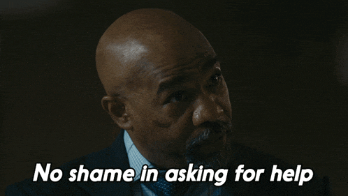 a man in a suit and tie is asking for help