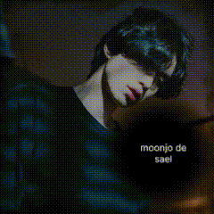 a man wearing a black shirt with moonjo de sael on it