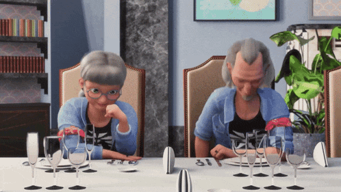 a man and woman sit at a table with glasses of wine
