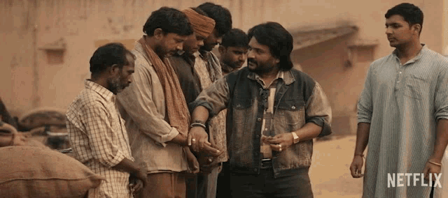 a group of men standing next to each other with netflix written on the bottom