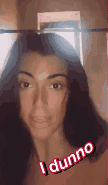 a woman with a caption that says i dunno on her face