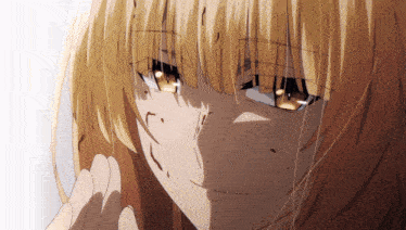 a close up of a girl 's face with a tear coming out of her eye