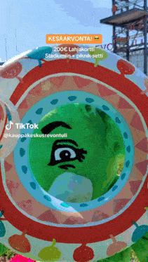 a tiktok video shows a colorful circle with a face drawn in the middle