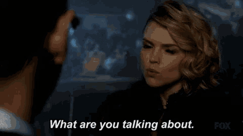 a man and a woman are talking to each other and the woman is asking the man what he is talking about .