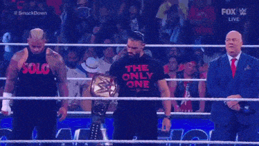 roman reigns is wearing a t-shirt that says the only one on it .