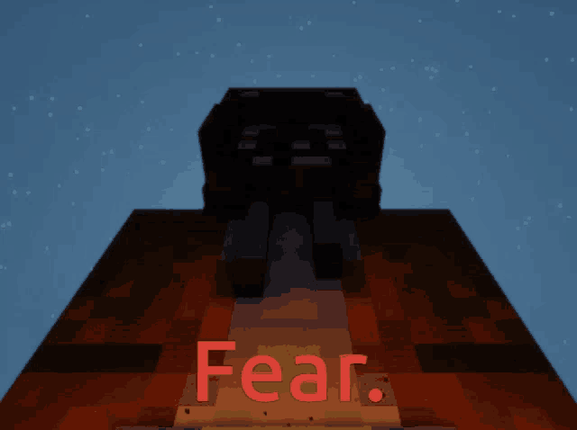 the word fear is on a brick building