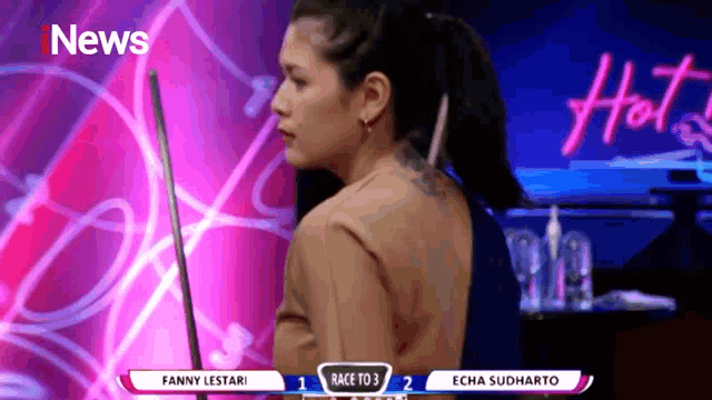 a woman stands in front of a sign that says hot