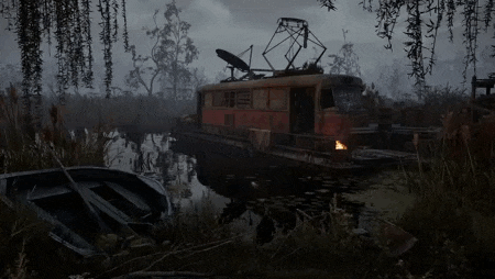 a boat is floating on top of a river next to a train .