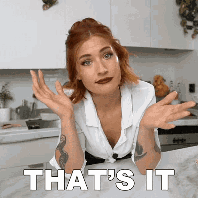 a woman sitting at a counter with the words that 's it written below her