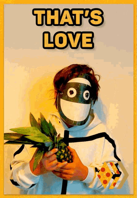 a person wearing a mask is holding a pineapple with the words that 's love behind them
