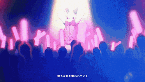 a crowd of people are watching a bunny on stage with a spotlight shining on her