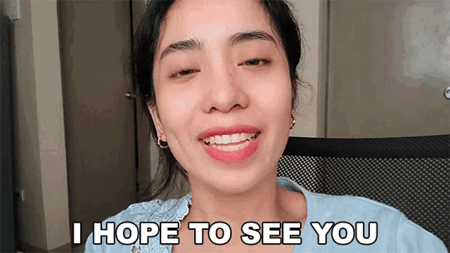 a woman says i hope to see you in front of her face