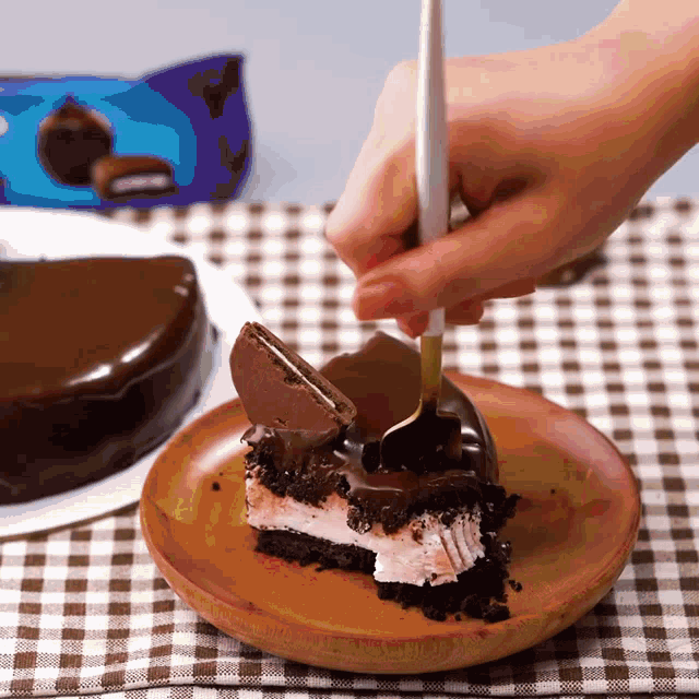 a person taking a piece of cake with a fork