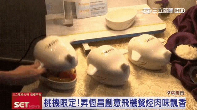 a person is using a soap dispenser in the shape of a plane