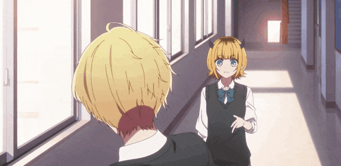 a man and a girl are standing in a hallway