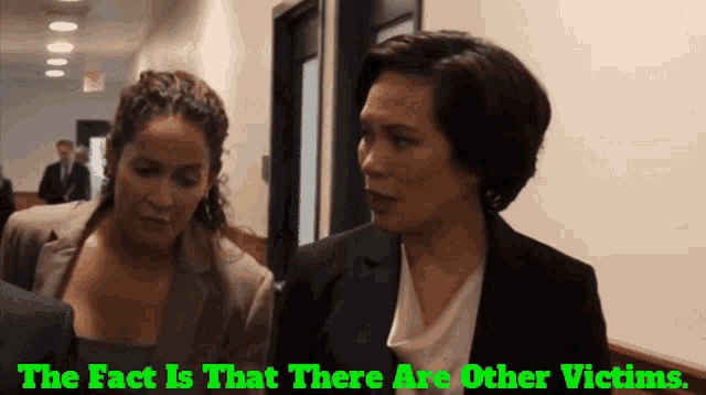 two women talking in a hallway with the words " the fact is that there are other victims "