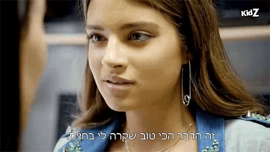 a close up of a woman 's face with a kid z logo on the bottom