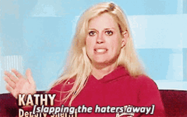 a woman in a red hoodie says kathy slapping the haters away