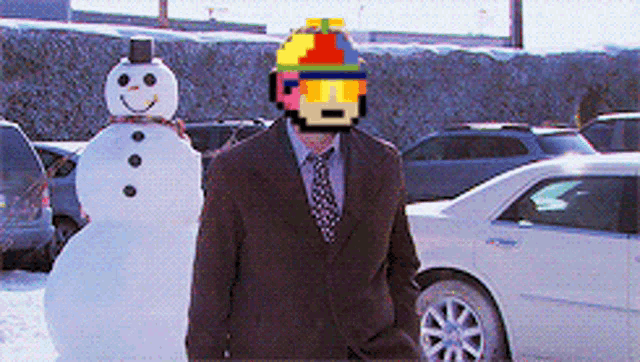 a man in a suit stands next to a snowman