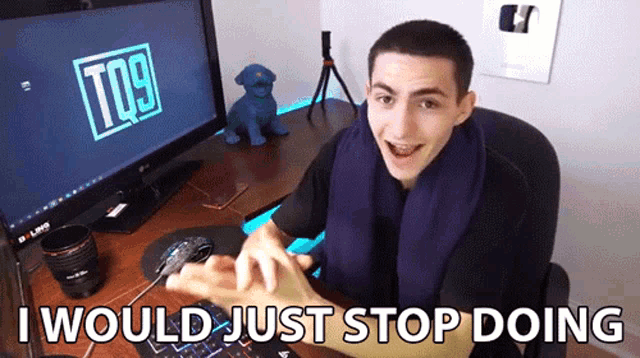 a man sitting in front of a computer with the words i would just stop doing