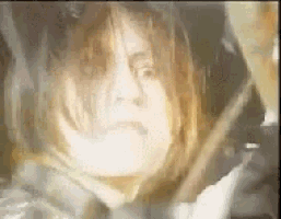 a close up of a woman 's face in a blurry photo