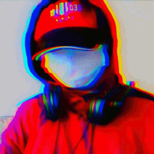 a man wearing a red hoodie and headphones has a red hat that says ' a ' on it