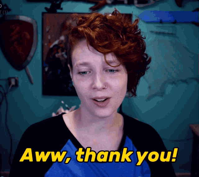 a woman says aww thank you in yellow letters