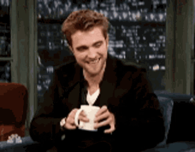 Robert Pattinson Elegance GIF - Robert Pattinson Elegance Laugh GIFs